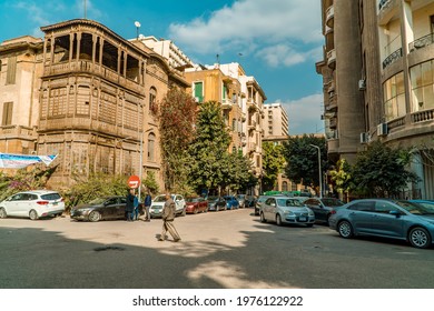 Cairo, Egypt - March 26, 2021 - Street Photography Of Cars, People, And Traditional Buildings In Garden City, Cairo