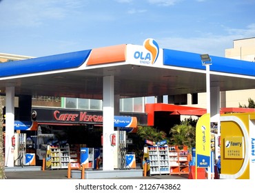 Cairo, Egypt, November 12 2021: Selective focus of OLA Energy gas and oil station previously Oilibya gas station with a blue cloudy sky, a petrol gas station of OLA energy group with a cafe inside it