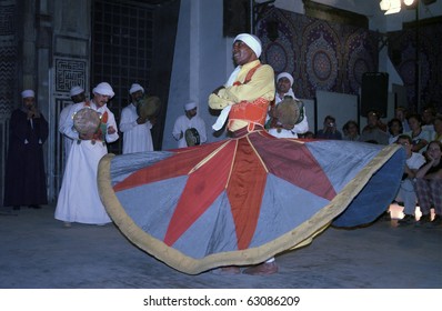 CAIRO, EGYPT - NOVEMBER 18 : Sufi dervishes dance in  Al Ghouri Medrese at 18, November, Cairo, Egypt. Whirling dervishes, special sect of Islam, dance for a spiritual relation with Allah.