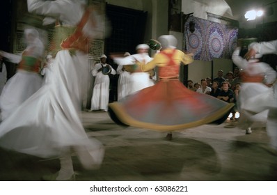 CAIRO, EGYPT - NOVEMBER 18 : Sufi dervishes dance in  Al Ghouri Medrese at 18, November, Cairo, Egypt. Whirling dervishes, special sect of Islam, dance for a spiritual relation with Allah.