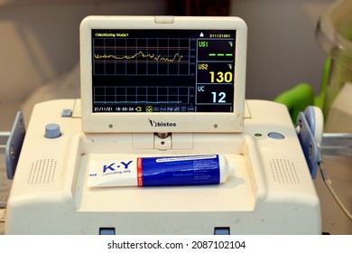 Cairo, Egypt, November 21 2021: Cardiotocography device placed on mother's abdomen recording the fetal heart rate obtained via ultrasound transducer, CTG is used to assess fetal well-being