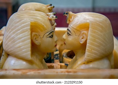 Cairo, Egyptian Museum, Tutankhamon alabaster, canopic box: The 4 human-headed jar lids wear the nemes, with snake and vulture - Shutterstock ID 2123291150