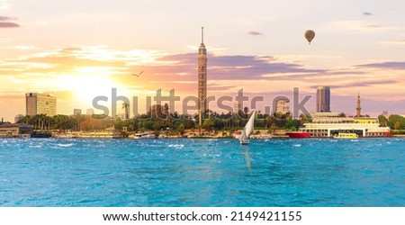 Cairo TV Tower with modern buildings, beautiful sunset, Egypt