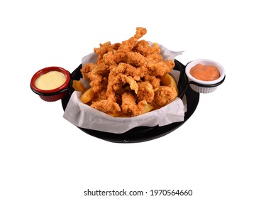 Cajun Chicken And Sauces In The Bucket. Fast Food Fries With Cajun Chicken. White Background