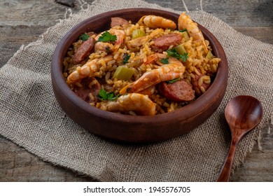 Cajun Cuisine. Jambalaya With Shrimps On An Old Wooden Background.