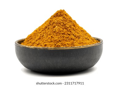 Cajun spice powder isolated on white background. Powdered dried cajun in bowl - Shutterstock ID 2311717911
