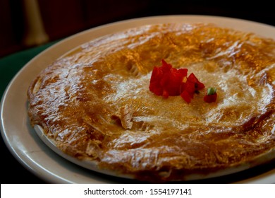 Cajun Style Crawfish Pot Pie With Homemade Crust Accented By Diced Red Pepper