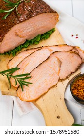 Cajun Style Roasted Turkey Breast Deli Sliced Lunch Meat On White Wooden Background. Selective Focus.