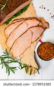 Cajun Style Roasted Turkey Breast Deli Sliced Lunch Meat On White Wooden Background. Selective Focus.