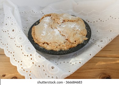 Cake With Apples And Pumpkins On Embroidered Tablecloth