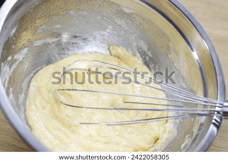 cake batter in a deep bowl and blender