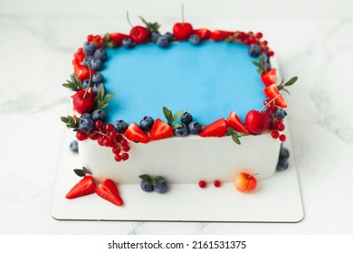 Cake For A Big Event Celebration With White Cream Cheese Frosting Decorated With Summer Berries On The White Background. Copy Space