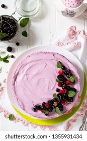 Cake With Black Currant Cream, Souffle And Biscuit On The White Kitchen Table. Top View Flat Lay Background, Copy Space.