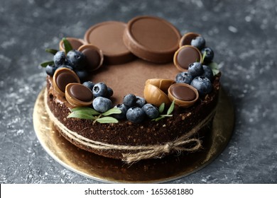 Cake with blueberry. With chocolate chip cookies and Toffifee sweets.