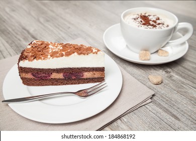 Cake And Coffee On Wood Table