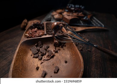 Cake Cooking Table With Hot Chocolat Stick On The Mixer And A Lot Of Dark Chocolat In A Wooden Tray.