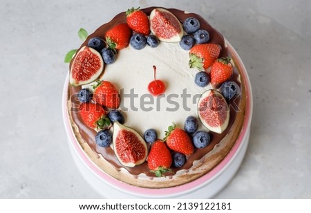Cake With Cream Cheese, Chocolate, Fresh Berries, Fruits On Turntable On Grey Background. Flat Lay.