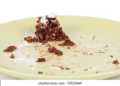 Cake Crumbs Leftovers On The Green Plate Isolated On White