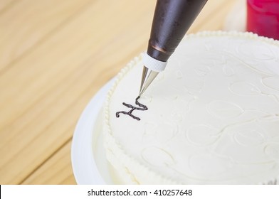 Cake Decorating Using Piping Tip For Writing A Word