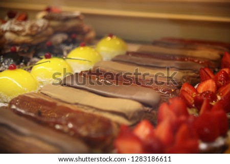 Cake eclair, decorated chocolate and coffee, strawberry cake and lemon, French baking. France.