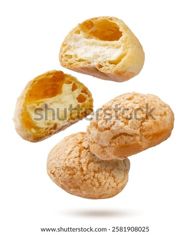 Cake eclairs shu and halves fly close-up on a white background. Isolated