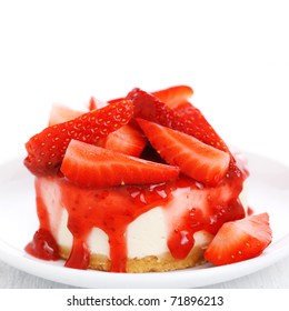 cake with fresh strawberry on white plate closeup