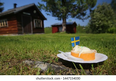 Cake in the grass on the National Day of Sweden.