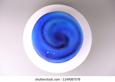 Cake With The Image Of The Cosmos Drawn By Airbrush. Galaxy, Stars In The Night Sky. Picture For A Menu Or A Confectionery Catalog. Top View.