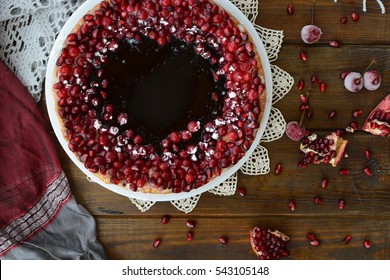 Cake With Jelly, Cranberry And Pomegranate On A Brown Wooden Table. Gala Dinner View From The Top