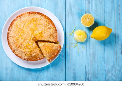 Cake with Lemon and Coconut.Homemade Cakes on a Blue Background.Copy space for Text. selective focus.