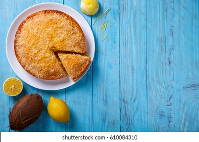 Cake with Lemon and Coconut.Homemade Cakes on a Blue Background.Copy space for Text. selective focus. - Shutterstock ID 610084310