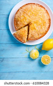 Cake with Lemon and Coconut.Homemade Cakes on a Blue Background.Copy space for Text. selective focus. - Shutterstock ID 610084328