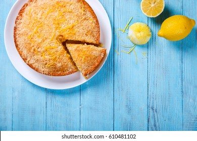 Cake with Lemon and Coconut.Homemade Cakes on a Blue Background.Copy space for Text. selective focus. - Shutterstock ID 610481102