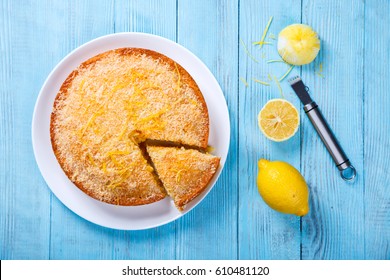 Cake with Lemon and Coconut.Homemade Cakes on a Blue Background.Copy space for Text. selective focus. - Shutterstock ID 610481120