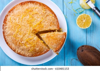 Cake with Lemon and Coconut.Homemade Cakes on a Blue Background.Copy space for Text. selective focus. - Shutterstock ID 610481153