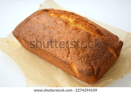 Cake, loaf baked , baking paper and cake, homemade , cake on white background, cut out, freshly baked cake, organic, citrus, lemon drizzle