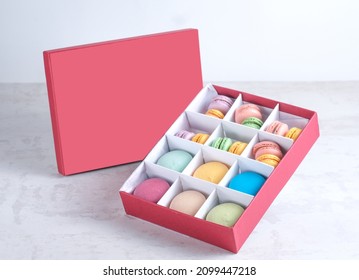 Cake Macaron Or Macaroon In A Gift Box On White Table. Sweet And Colorful Dessert.