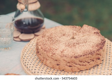 Cake on the table in the park close-up shot