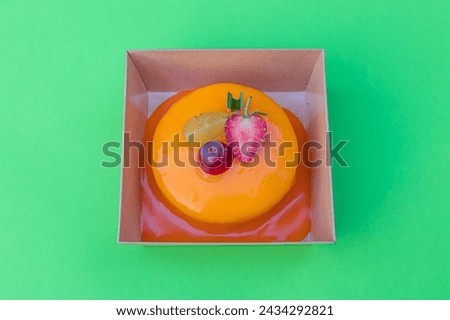 cake orange lave isolated on green