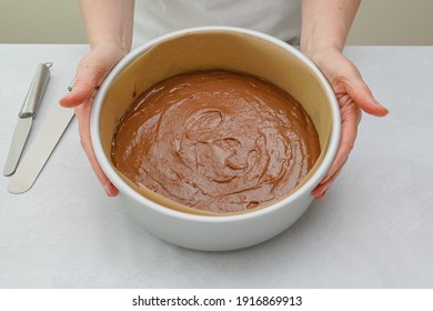 Cake Pan With Cake Batter Close Up On Kitchen Table, Close Up Baking Process. Chocolate Cake Step By Step Recipe, Woman Hands