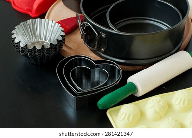 Cake Pans And Round Metal Bakeware, Wooden Rolling Pin On A Wooden Background