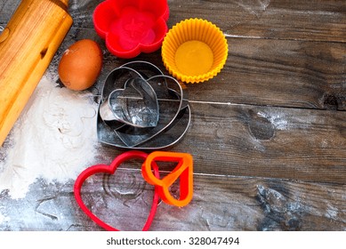 Cake Pans And Round Metal Bakeware, Wooden Rolling Pin On A Wooden Background