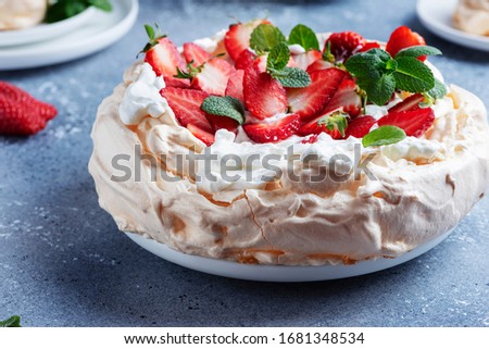 Cake Pavlova with meringue, strawberry and cream, selective focus image