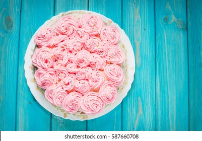 Cake With Pink Cream On Blue Wood Background. Pink Cake. Top View