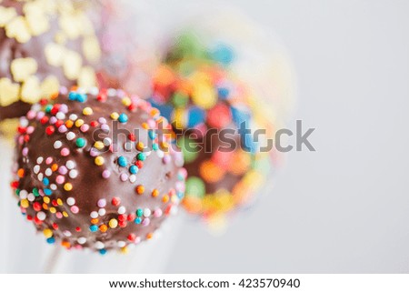 Similar – Dot on chocolate Candy