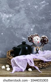 Cake pops. Round candy on a stick in chocolate glaze.