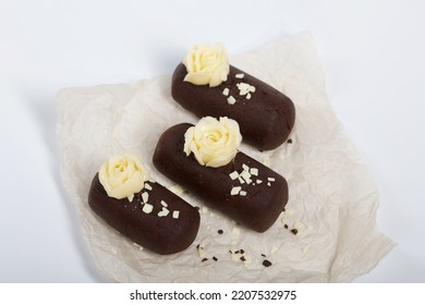 Cake Potato. Decorated With Butter Cream. On A White Background. Shot Close-up.