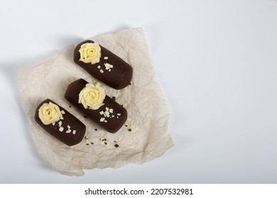 Cake Potato. Decorated With Butter Cream. On A White Background. Shot Close-up.