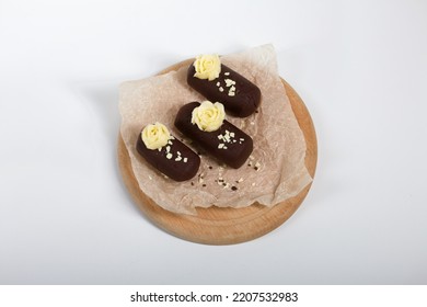 Cake Potato. Decorated With Butter Cream. On A White Background. Shot Close-up.