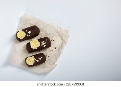 Cake Potato. Decorated With Butter Cream. On A White Background. Shot Close-up.